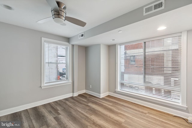 unfurnished room featuring hardwood / wood-style flooring and ceiling fan