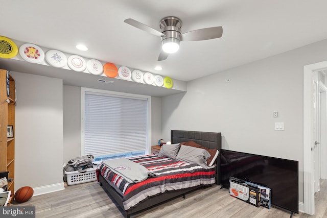 bedroom featuring ceiling fan and light hardwood / wood-style flooring