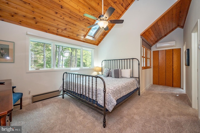 bedroom with a skylight, ceiling fan, light carpet, and a wall mounted air conditioner