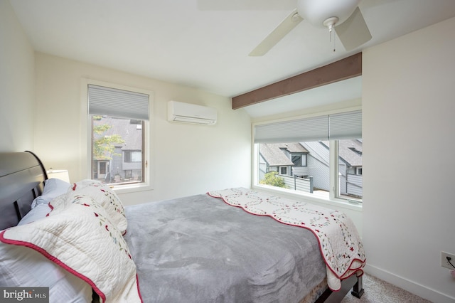 carpeted bedroom with a wall mounted AC, multiple windows, beamed ceiling, and ceiling fan