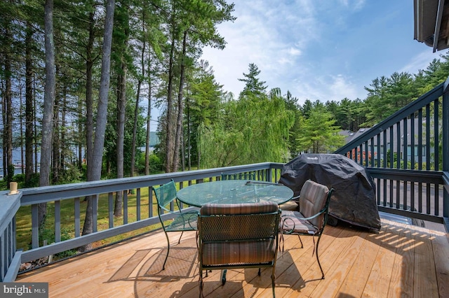 wooden deck featuring area for grilling