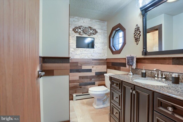 625 Brown Rd, Myerstown, PA 17067 - bathroom with a baseboard radiator, vanity, wainscoting, and a textured ceiling