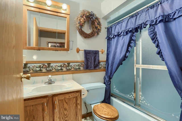 full bathroom with shower / bath combo with shower curtain, vanity, and toilet