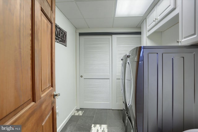 laundry room with cabinets and separate washer and dryer