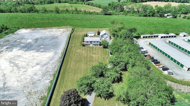 birds eye view of property featuring a rural view