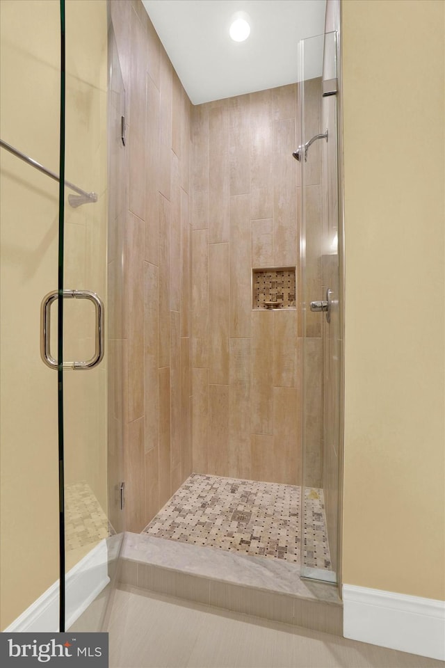 bathroom featuring an enclosed shower