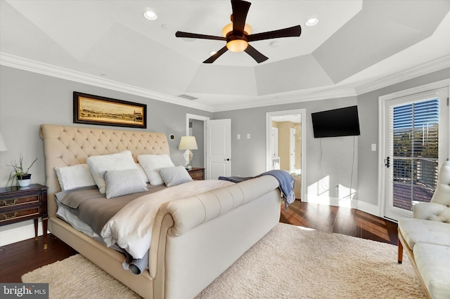 bedroom featuring a raised ceiling, access to exterior, ceiling fan, and dark wood-type flooring