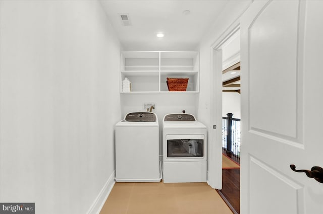 laundry room featuring washing machine and dryer