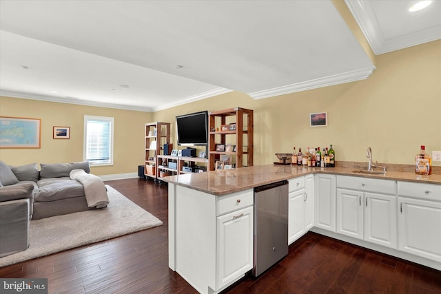 kitchen with white cabinets, dark hardwood / wood-style floors, kitchen peninsula, and sink