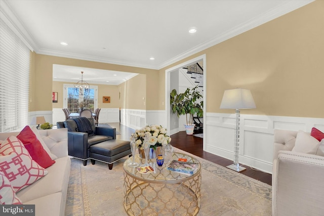 living room with crown molding and wood-type flooring