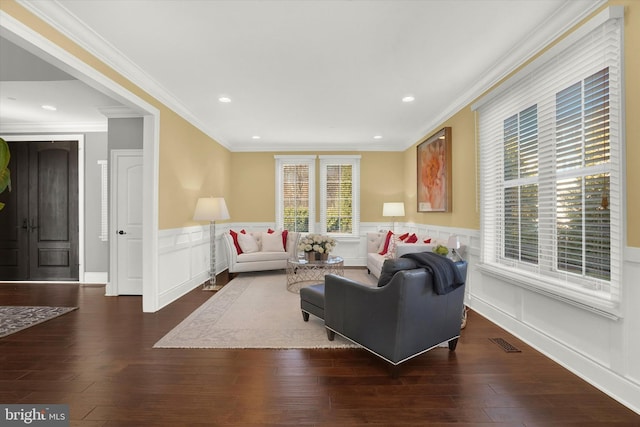 living room featuring dark hardwood / wood-style flooring and ornamental molding