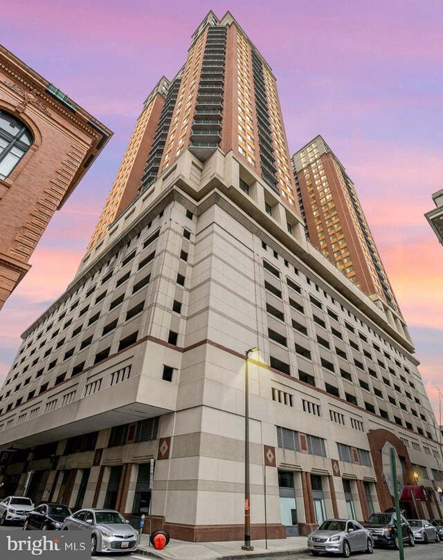 view of outdoor building at dusk