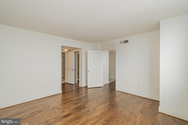 unfurnished room featuring wood-type flooring