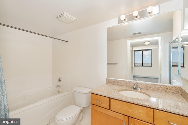 bathroom featuring tile floors, large vanity, and toilet