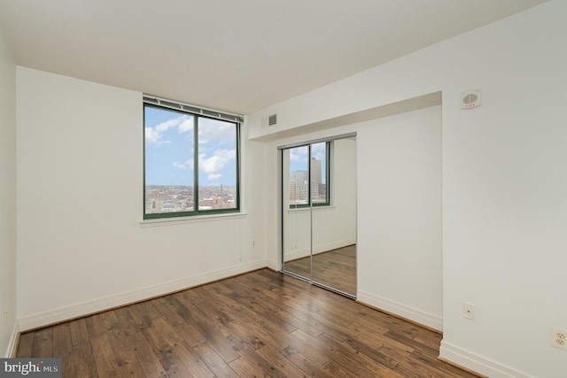 empty room featuring dark hardwood / wood-style floors