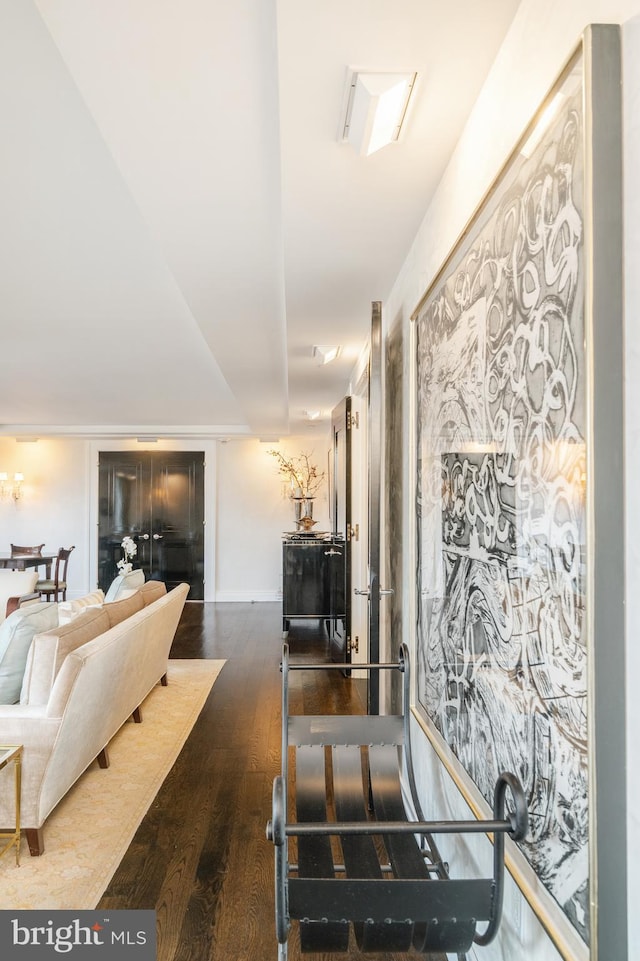 interior space with stainless steel counters and dark hardwood / wood-style floors