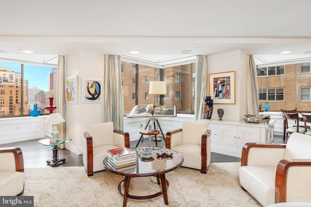 living area featuring floor to ceiling windows