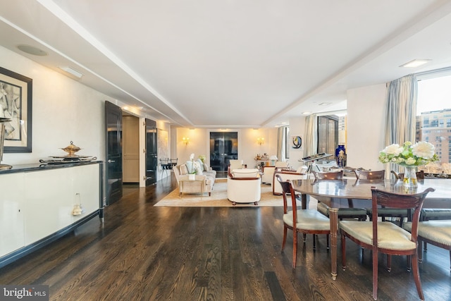 dining space featuring wood-type flooring