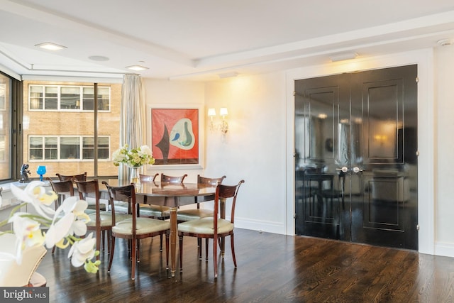 dining area with dark hardwood / wood-style flooring