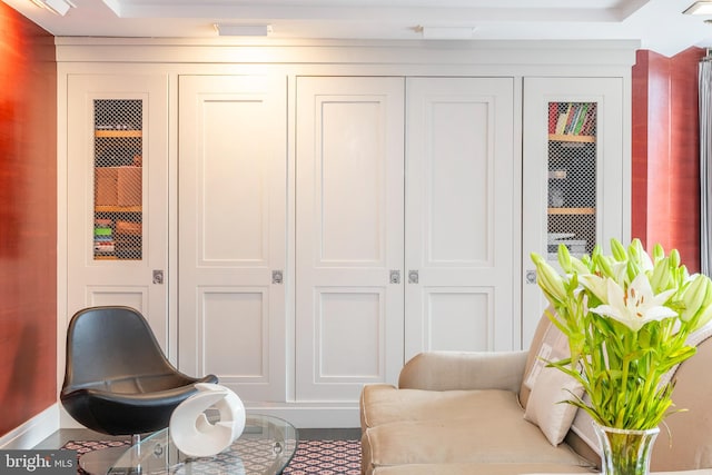 living area with a tray ceiling