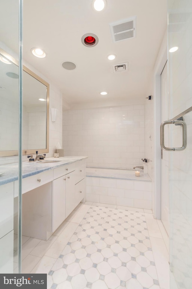 bathroom featuring vanity and tile flooring