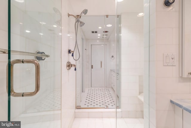 bathroom featuring an enclosed shower