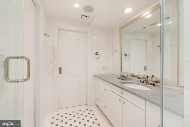 bathroom featuring vanity and tile floors