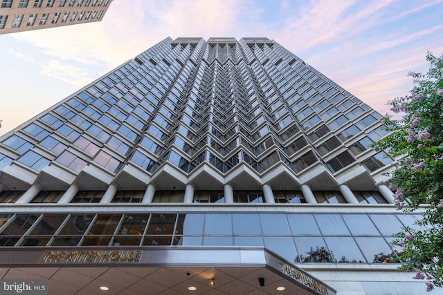 view of outdoor building at dusk