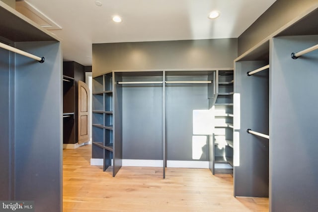 walk in closet featuring hardwood / wood-style floors