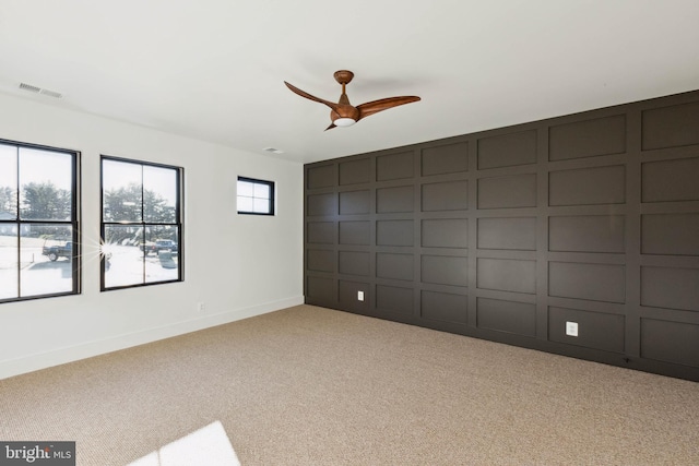 carpeted empty room with ceiling fan