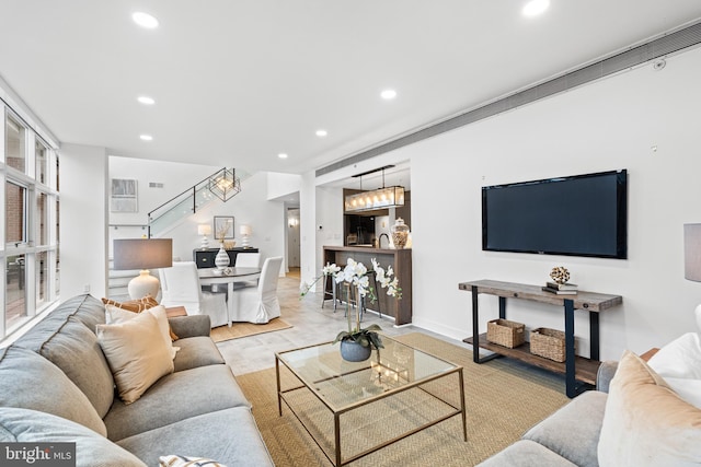 living room with light wood-type flooring and sink