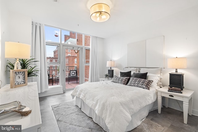 bedroom featuring access to outside and light hardwood / wood-style flooring