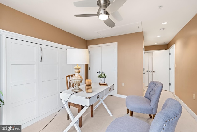 home office with ceiling fan and light colored carpet