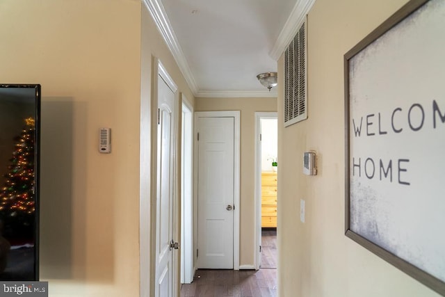 hall featuring dark hardwood / wood-style floors and crown molding