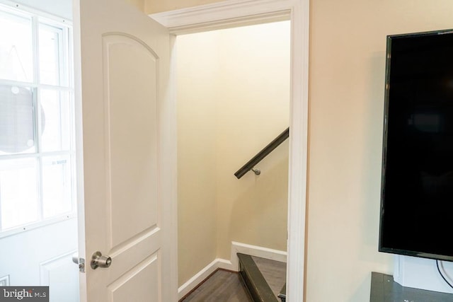 stairs with wood-type flooring