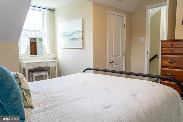 bedroom featuring lofted ceiling