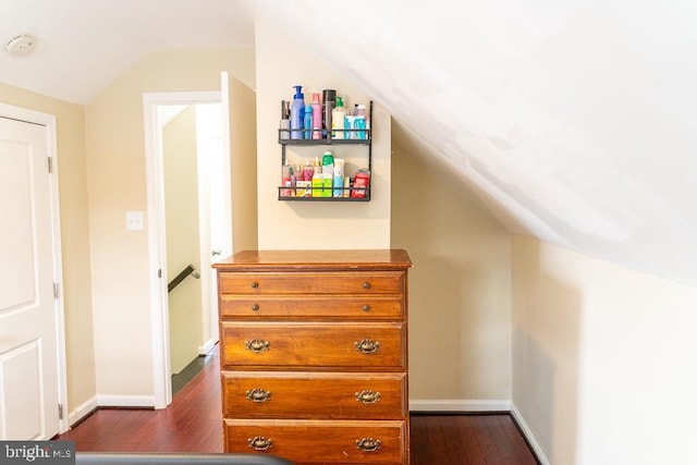 interior space with vaulted ceiling and hardwood / wood-style flooring