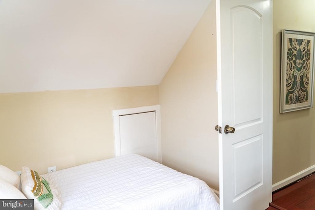 bedroom featuring lofted ceiling