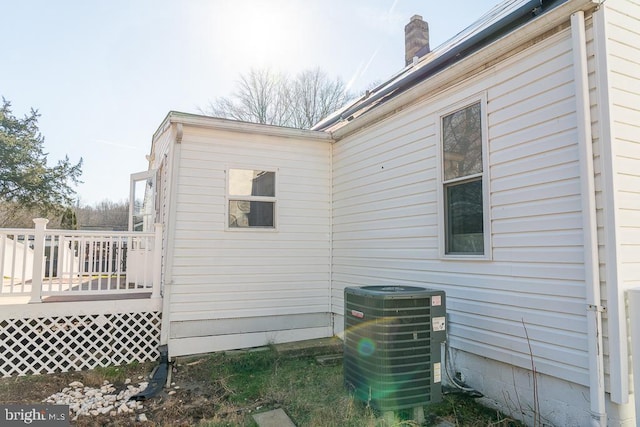 view of side of home featuring central air condition unit