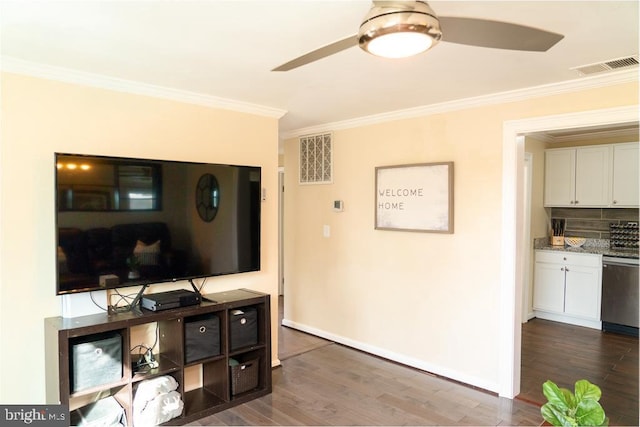 living room featuring ceiling fan, dark hardwood / wood-style flooring, and ornamental molding