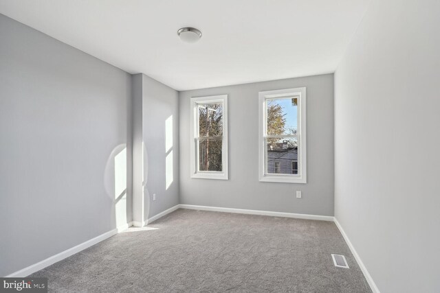 unfurnished room featuring carpet floors