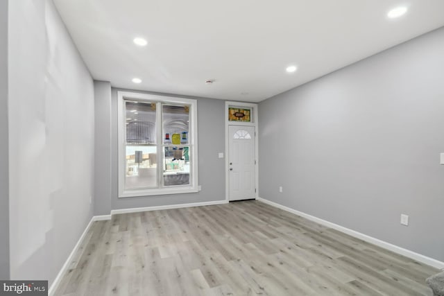 foyer entrance with light hardwood / wood-style flooring