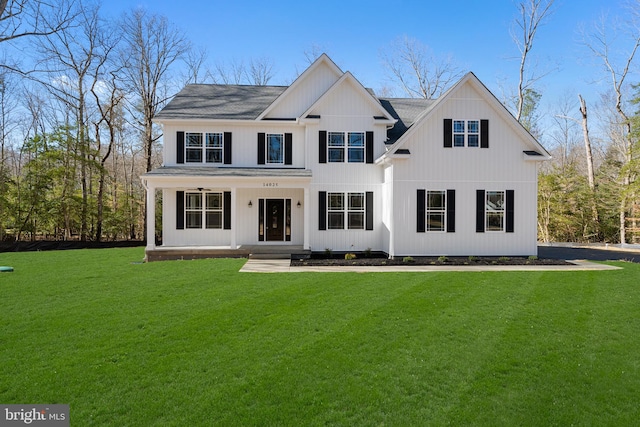 modern farmhouse style home with a front yard