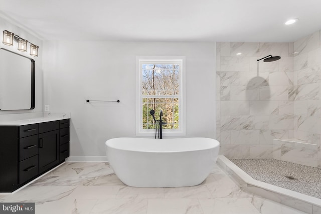 bathroom featuring tile flooring, vanity, and tiled shower