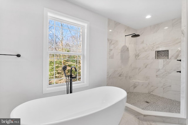 bathroom featuring tile floors and independent shower and bath