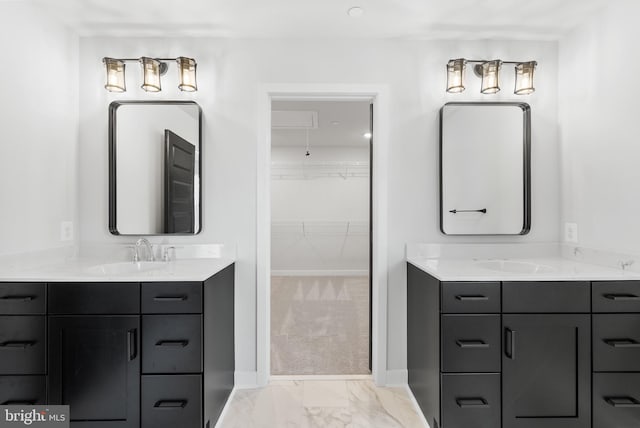 bathroom with double sink, tile floors, and vanity with extensive cabinet space