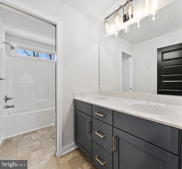 bathroom with washtub / shower combination, dual bowl vanity, and tile flooring