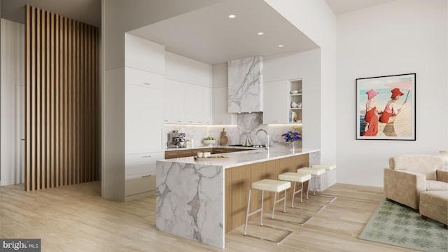 390 Ocean Ave Unit 1403, Long Branch, NJ 07740 - kitchen featuring modern cabinets, a peninsula, light wood-type flooring, a kitchen breakfast bar, and open shelves