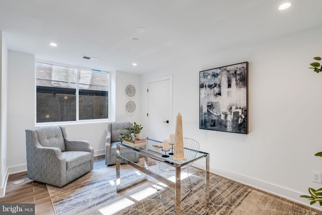 home office with wood-type flooring