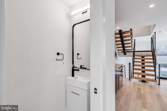 bathroom featuring vanity and hardwood / wood-style flooring